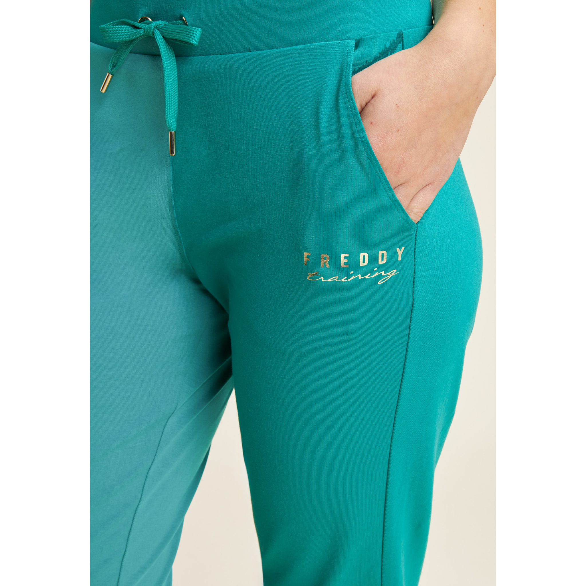 Pantaloni slim fit in jersey con dettagli floreali