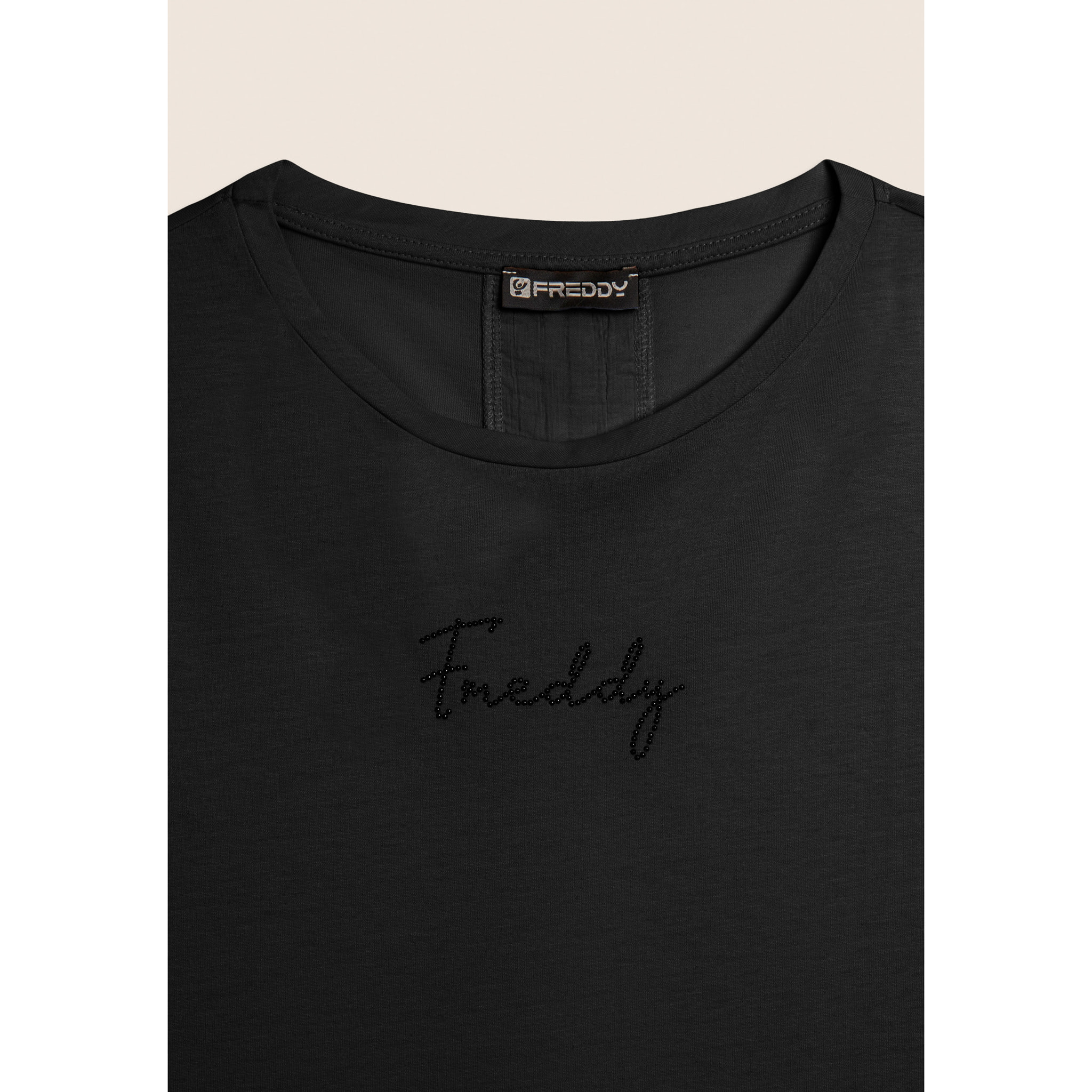 T-shirt con inserto crinkle sul retro e dettagli animalier