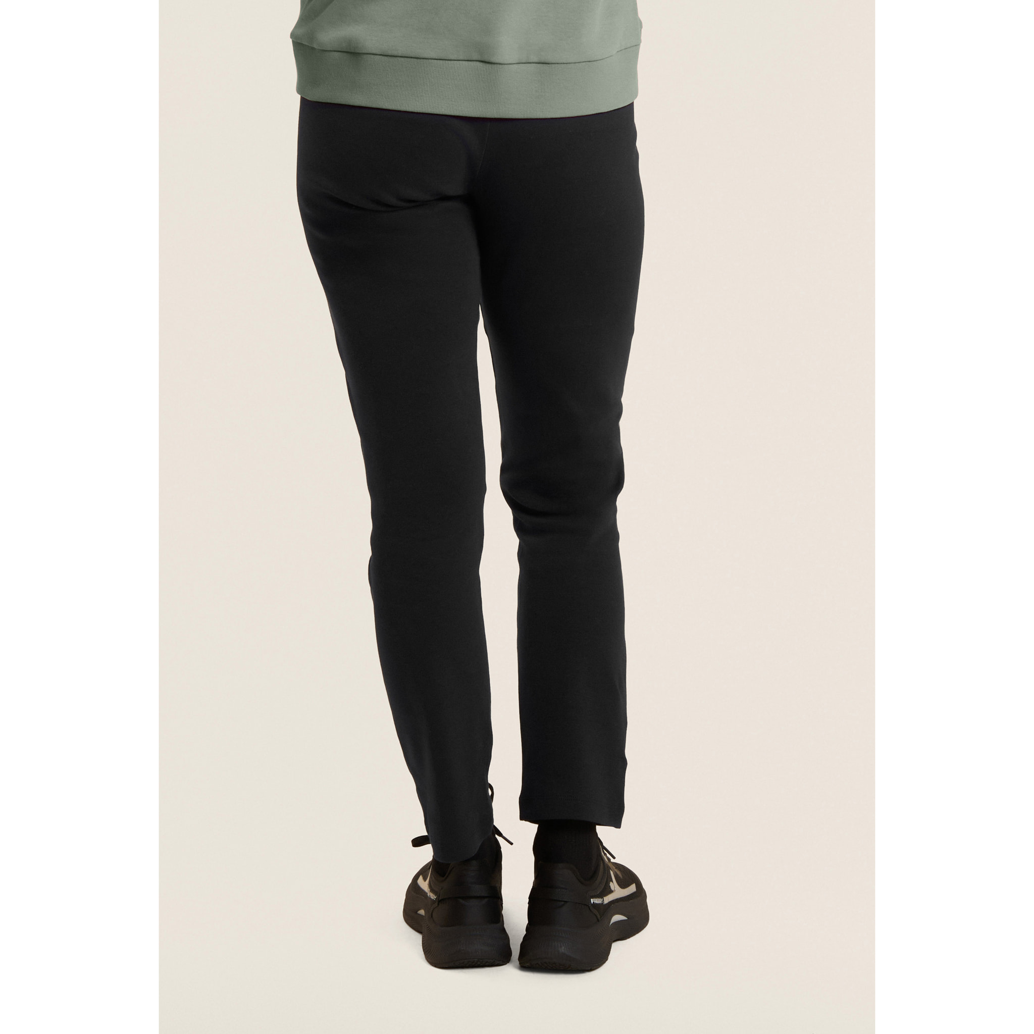 Tuta con zip e collo alto, logo in perline