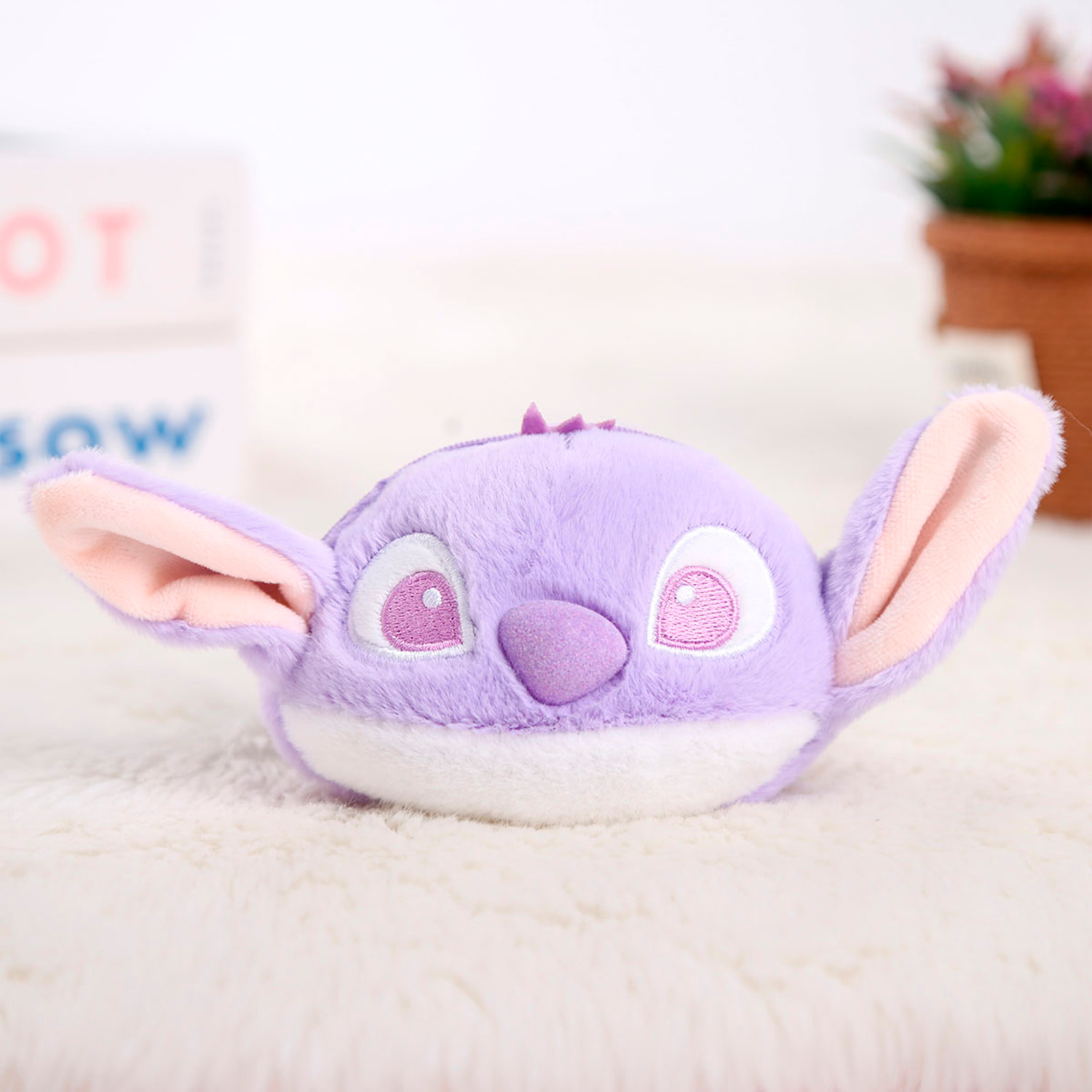 Monedero extrasuave. Diseño de monstruito morado. 10 cm.