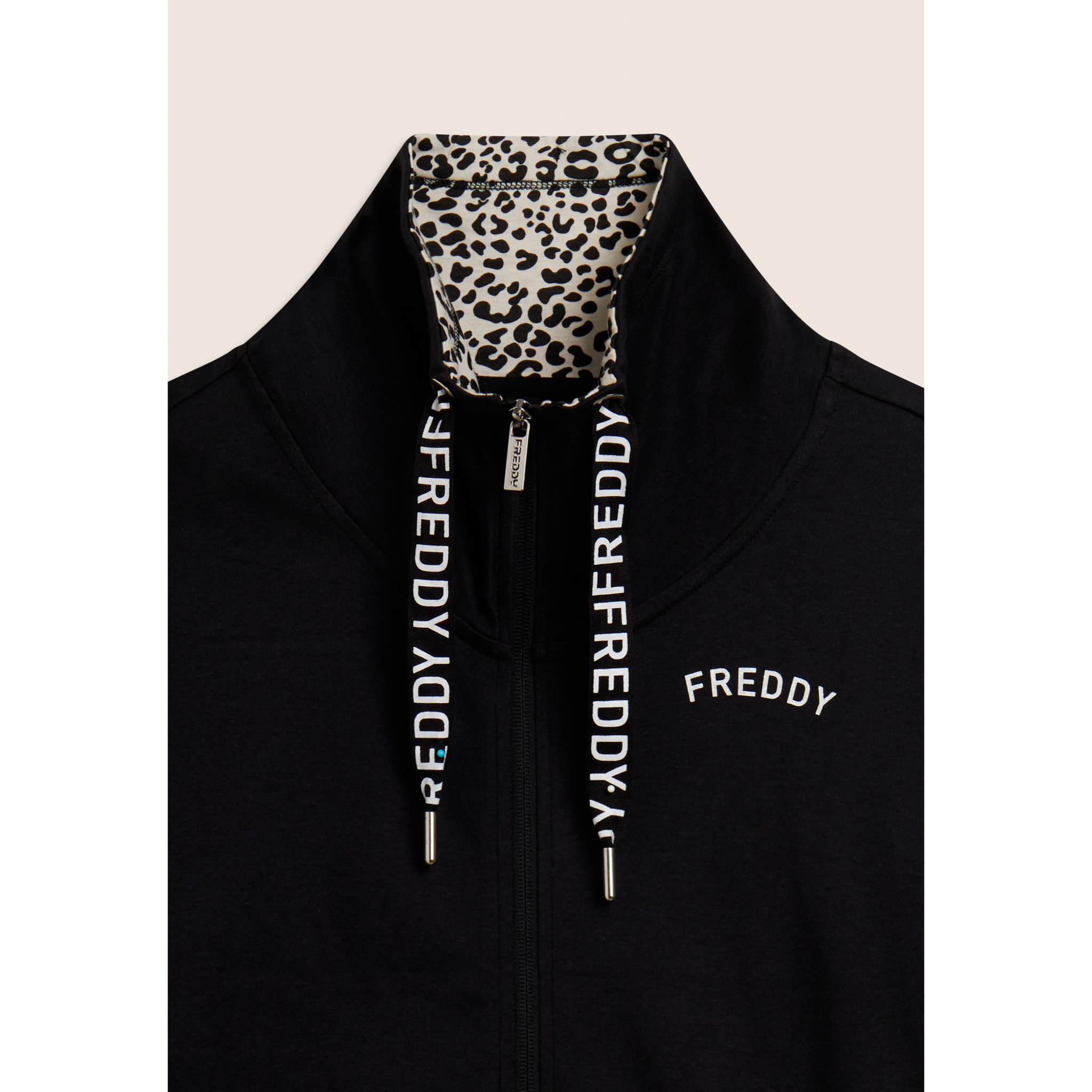 Tuta con zip e collo alto con interno animalier