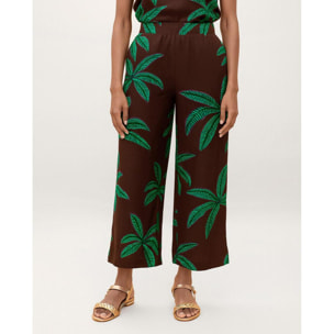 Pantaloni con sfondo marrone e palme