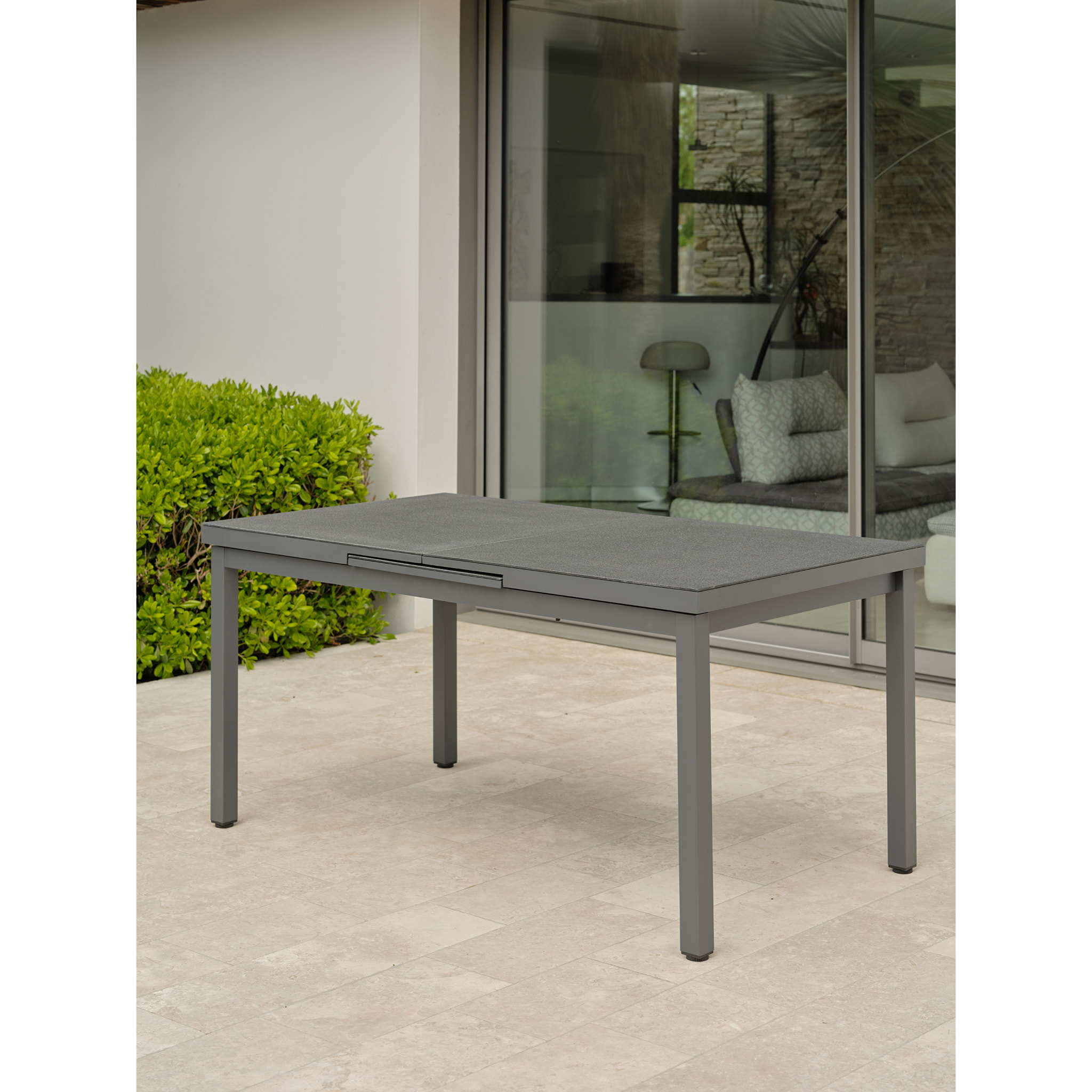 DANIA - Table en alu et spraystone avec rallonge automatiquee