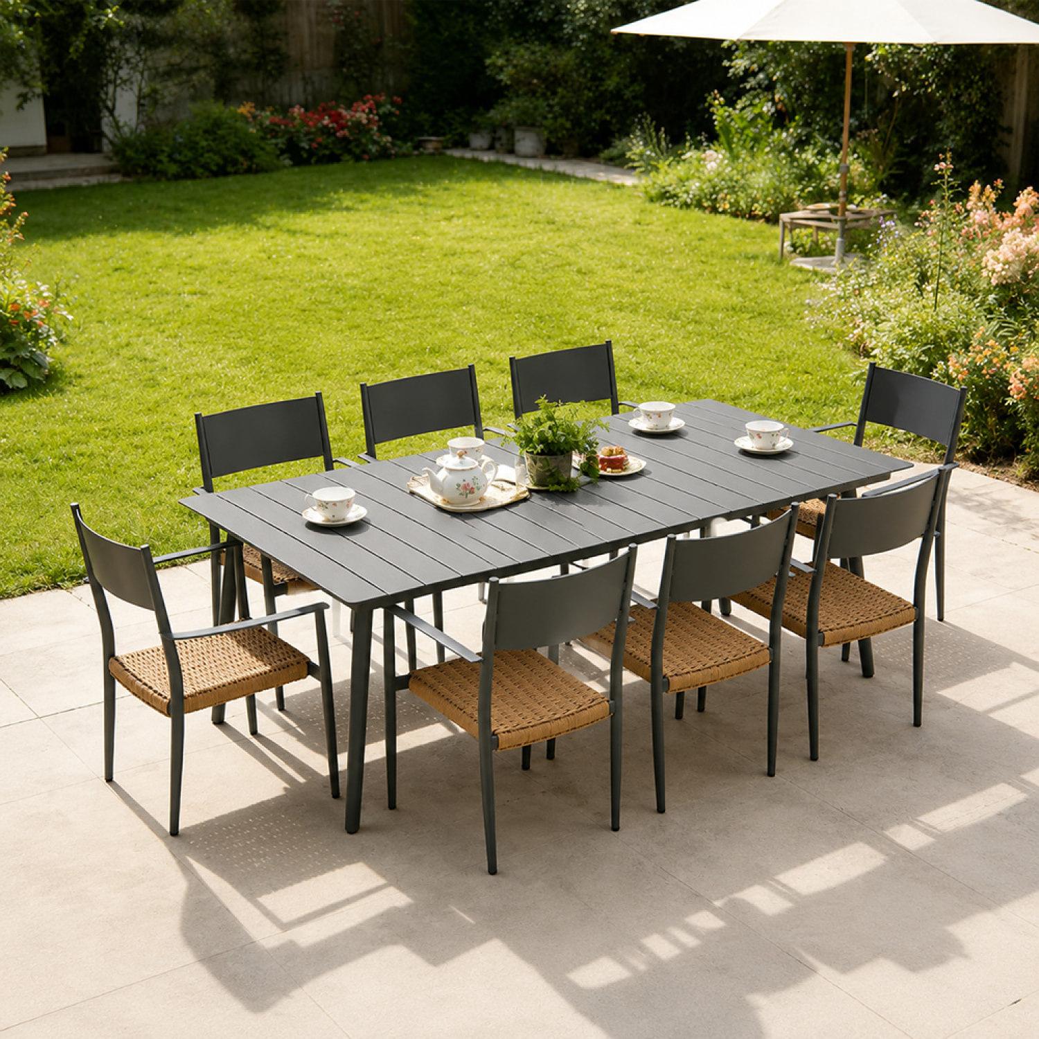 Ensemble table de jardin 200 cm et 8 fauteuils gris foncé effet rotin BRADDON