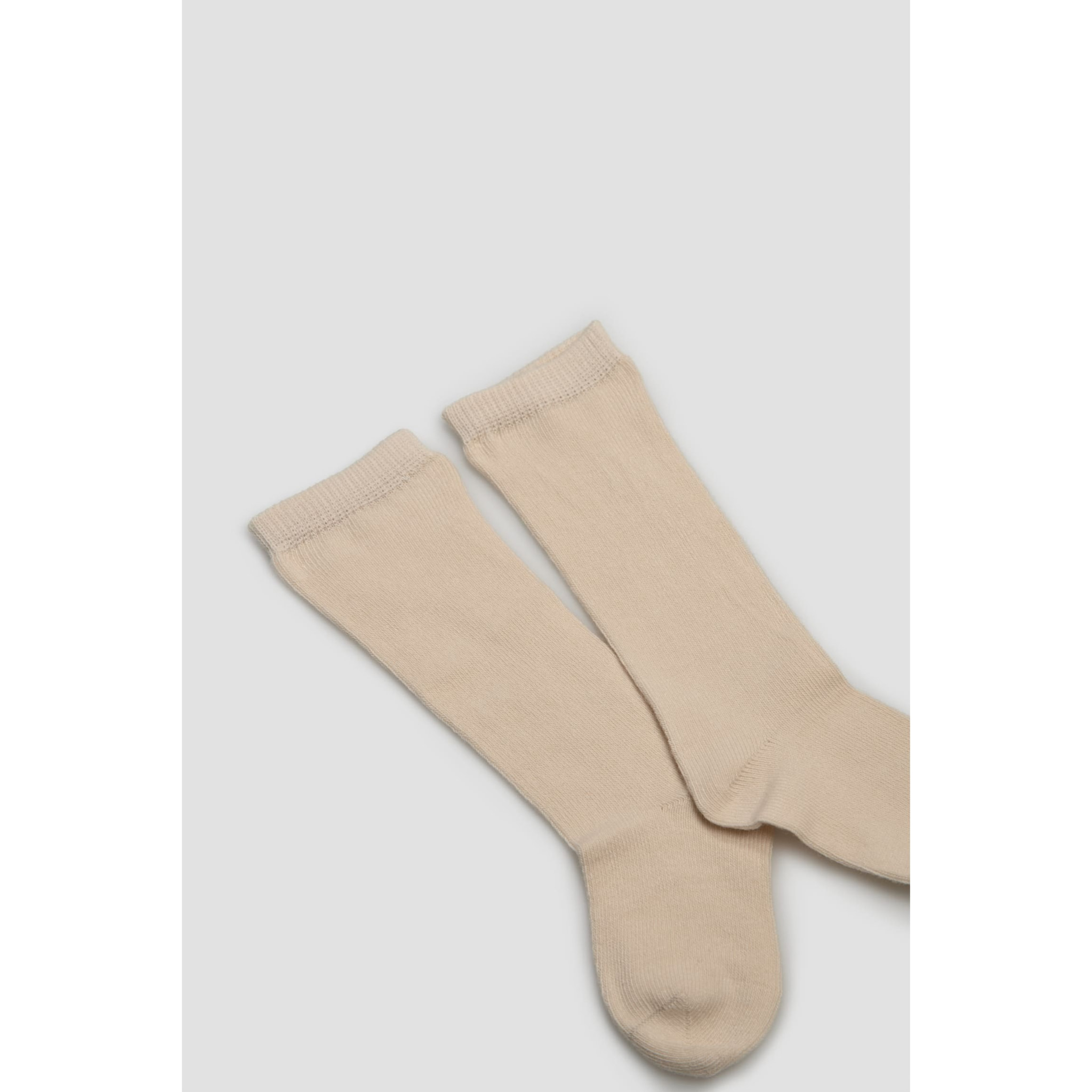 Calzini lunghi beige basico per neonato