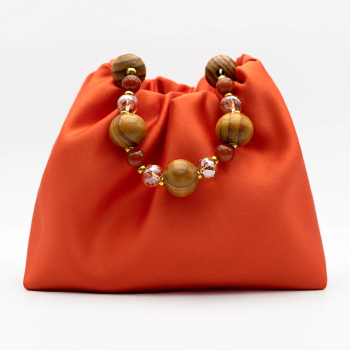 Bolso de mano con asa de piedras