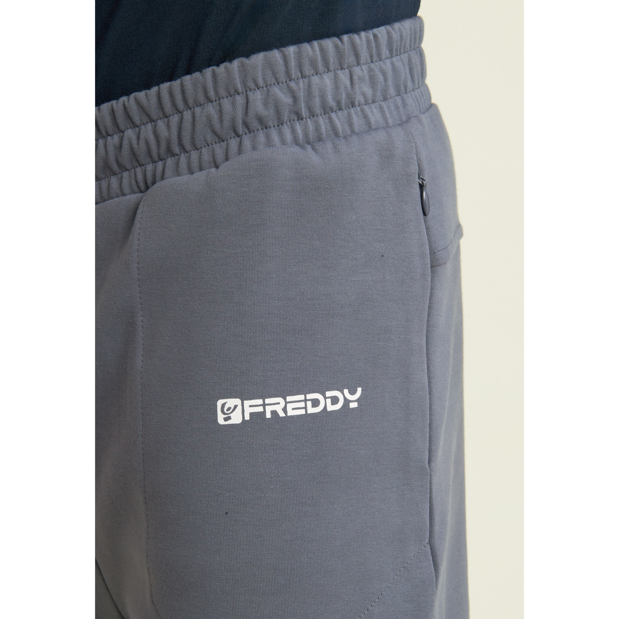 Pantaloni slim in interlock con dettagli lucidi