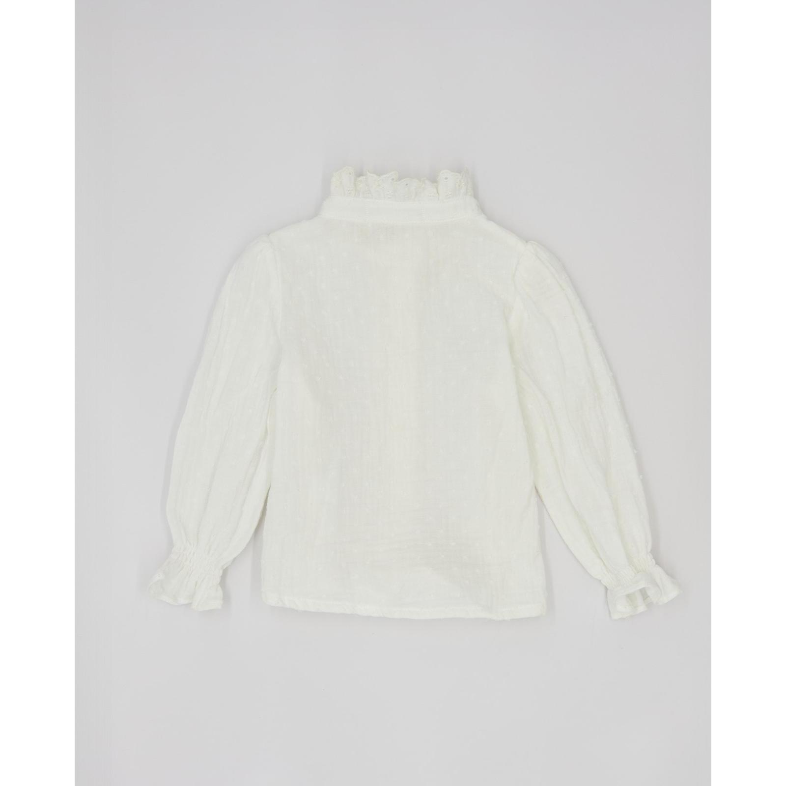 Camisa con detalles y gomitas en los puños