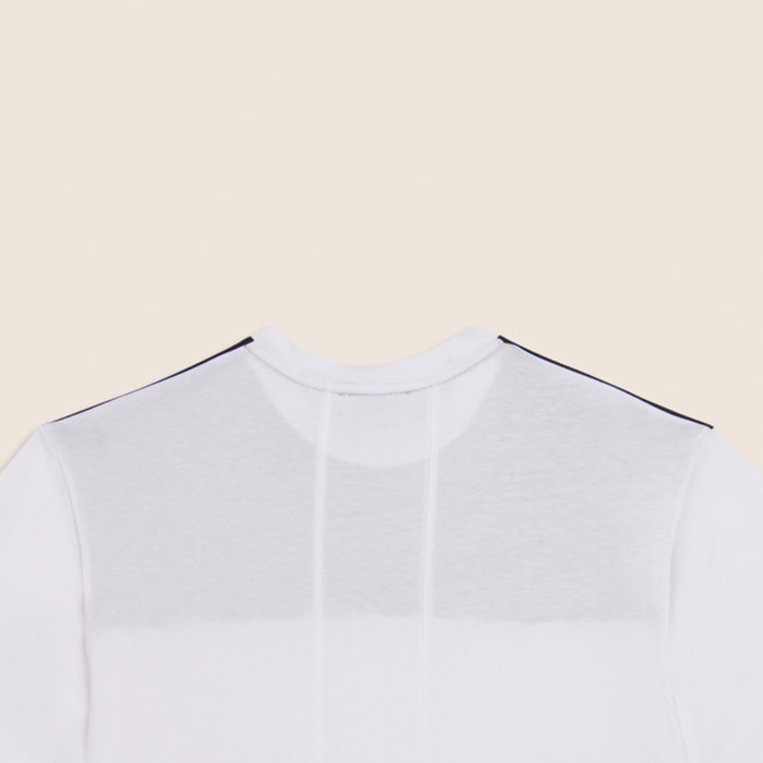 T-shirt con stampa fantasia e taschino zippato