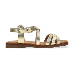 Sandalias planas doradas en piel con hebilla