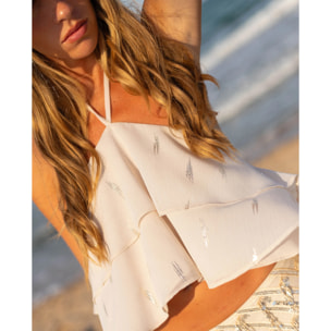 Top de mujer de gasa con volantes y cuello halter ajustable.