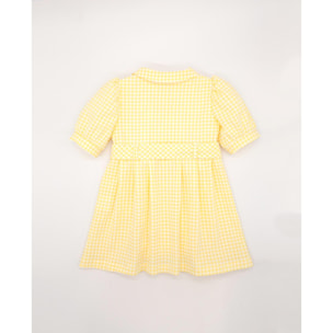 Vestido de manga corta de cuadros vichy amarillos. Bolsillos, cuello y cinturon. Botones en el centro.