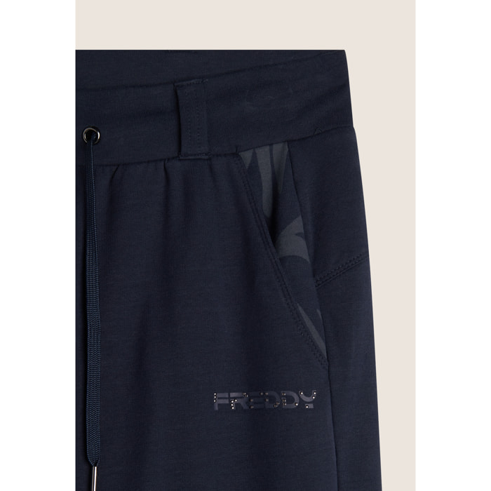 Pantaloni donna slim fit in felpa con apertura sul fondo