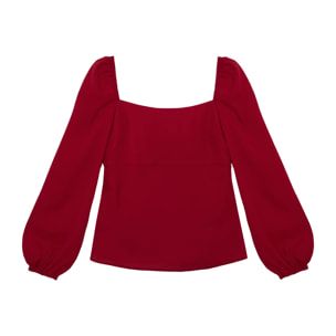 Blusa de manga larga con lazos en la espalda.