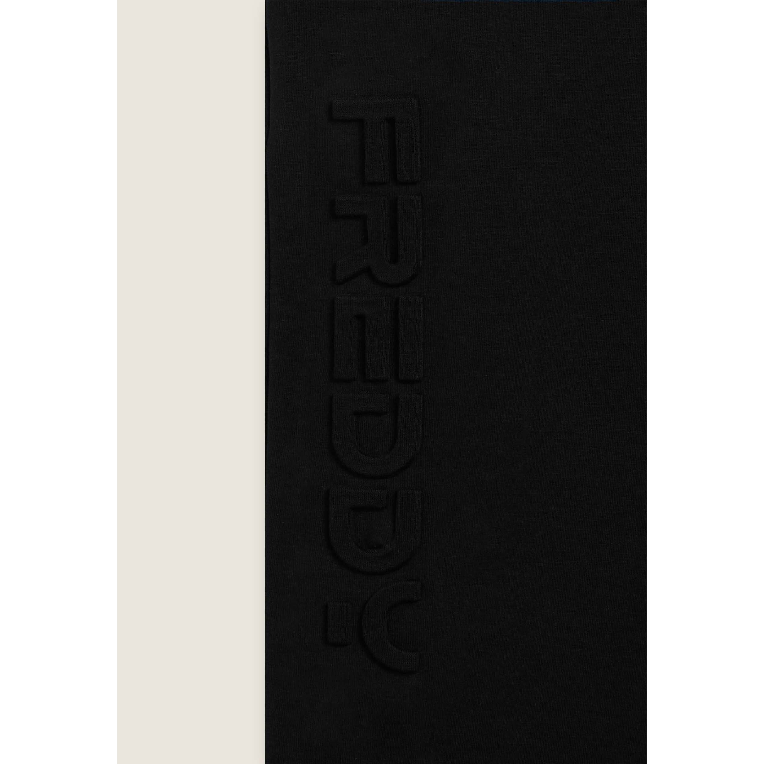 Pantaloni slim in interlock con maxi logo in rilievo