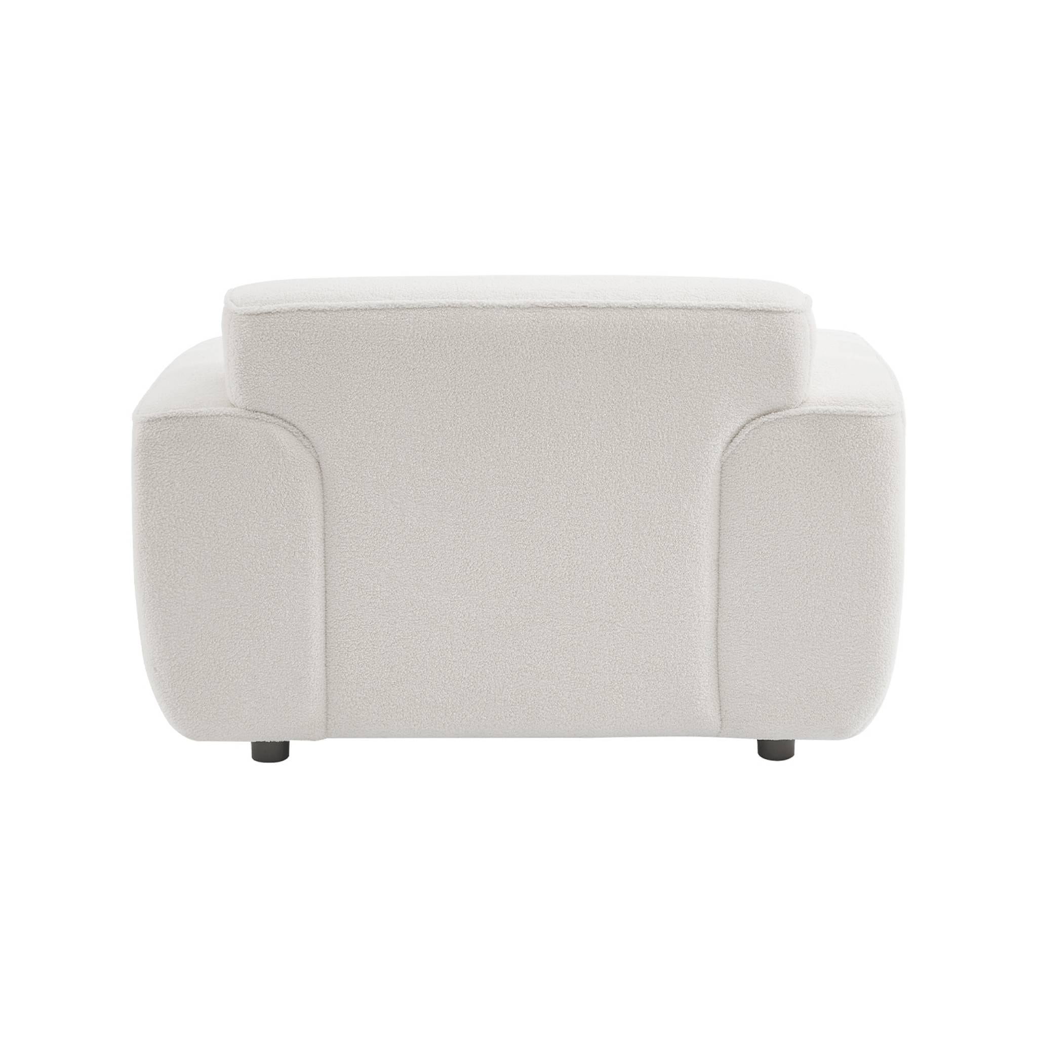 Fauteuil tissu bouclette blanche. lignes arrondis. coussin fourni. Wallas. L 116 x P 97 x H 73cm