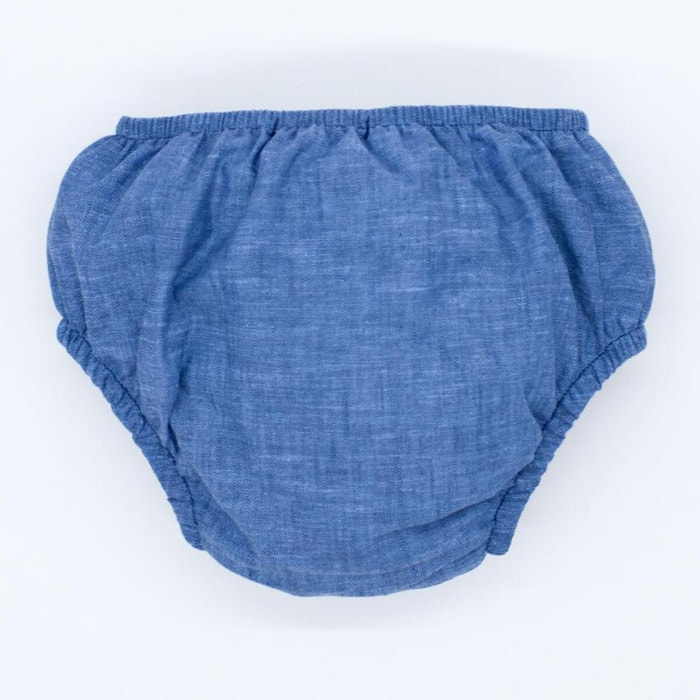 Cubrepañal de chambrai azul. Elastico en la cintura y en las piernas.