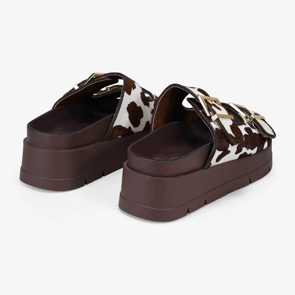 Sandalias de plataforma con pelo print vaca