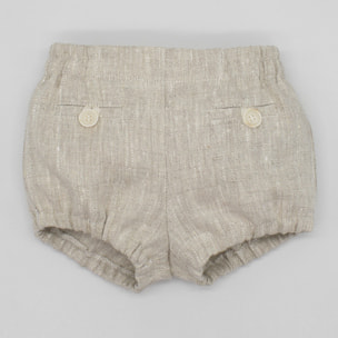 Bermuda corta de lino beige. Con falsos bolsillos y botones. Cintura y piernas elasticas.