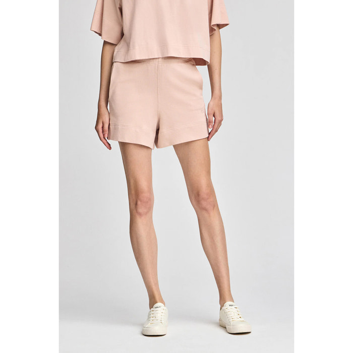 Pantaloncini in cotone nude con logo ricamato