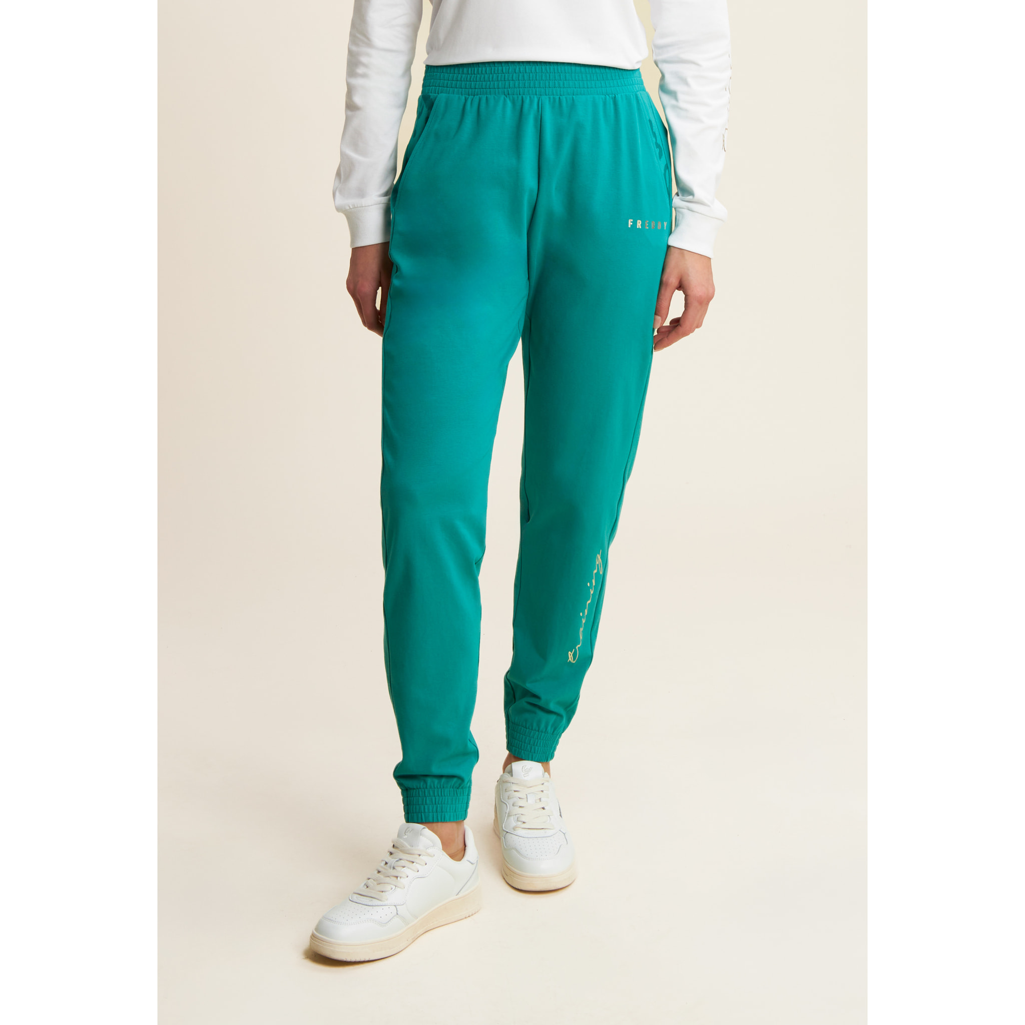 Pantaloni con elastico sul fondo e dettagli floreali